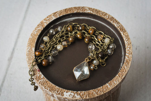 Adjustable, multi strand bracelet with stone beading