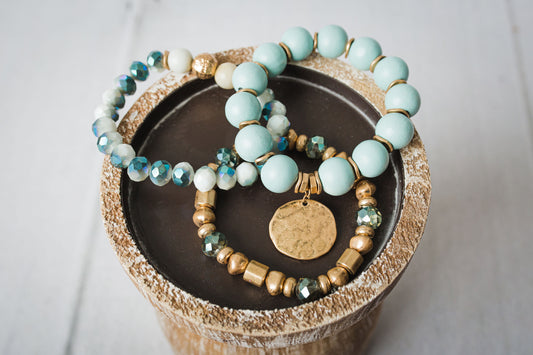 Set of stretch beaded bracelets that can be worn together or alone.